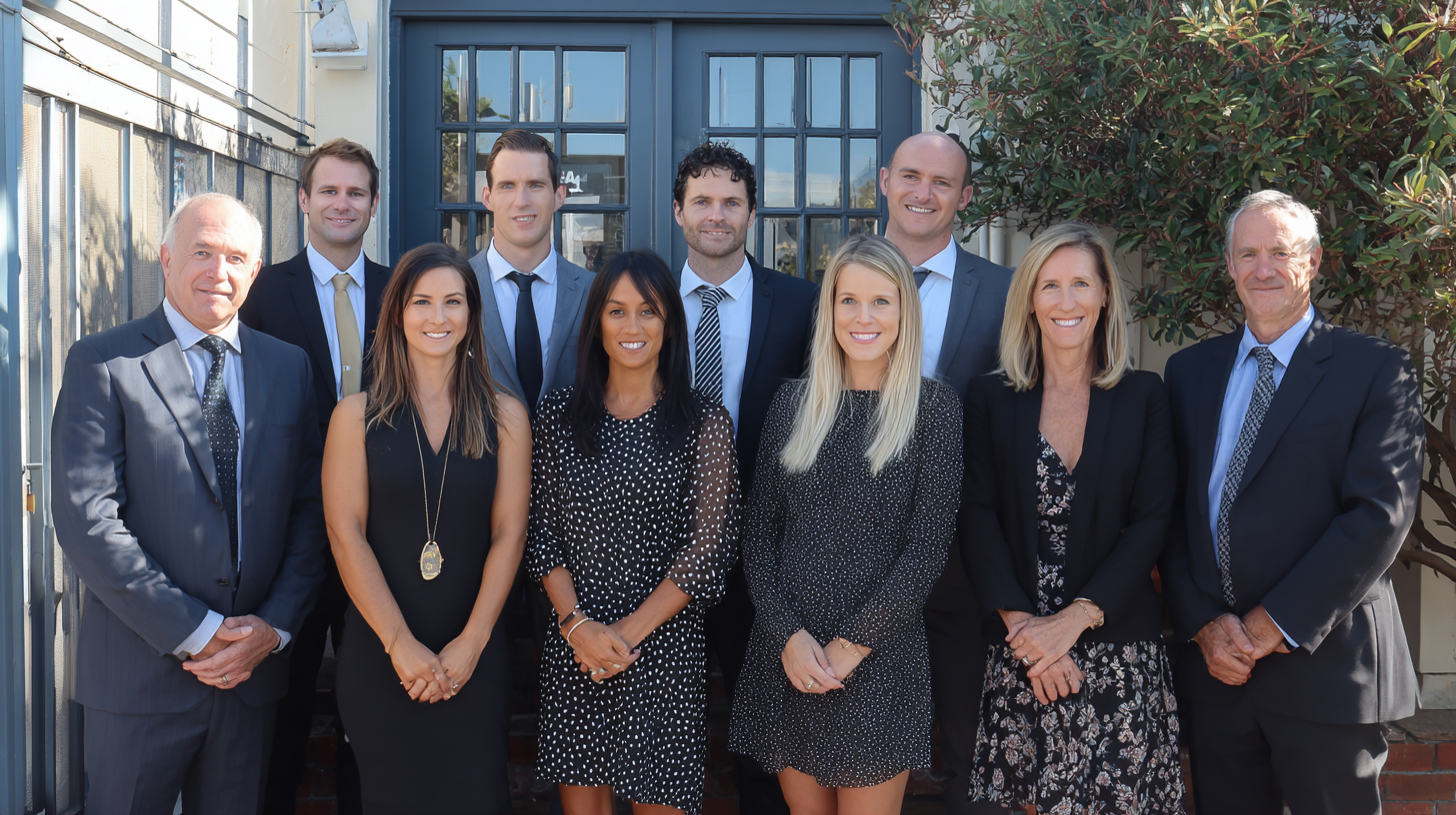 A team of personal injury lawyers standing outside their office in Macquarie Park.