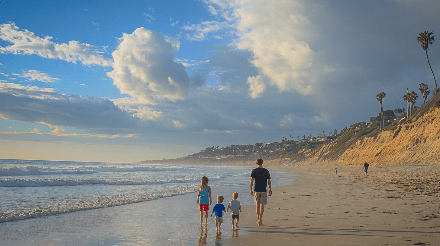 A family walking on the beach in Del Mar, California.