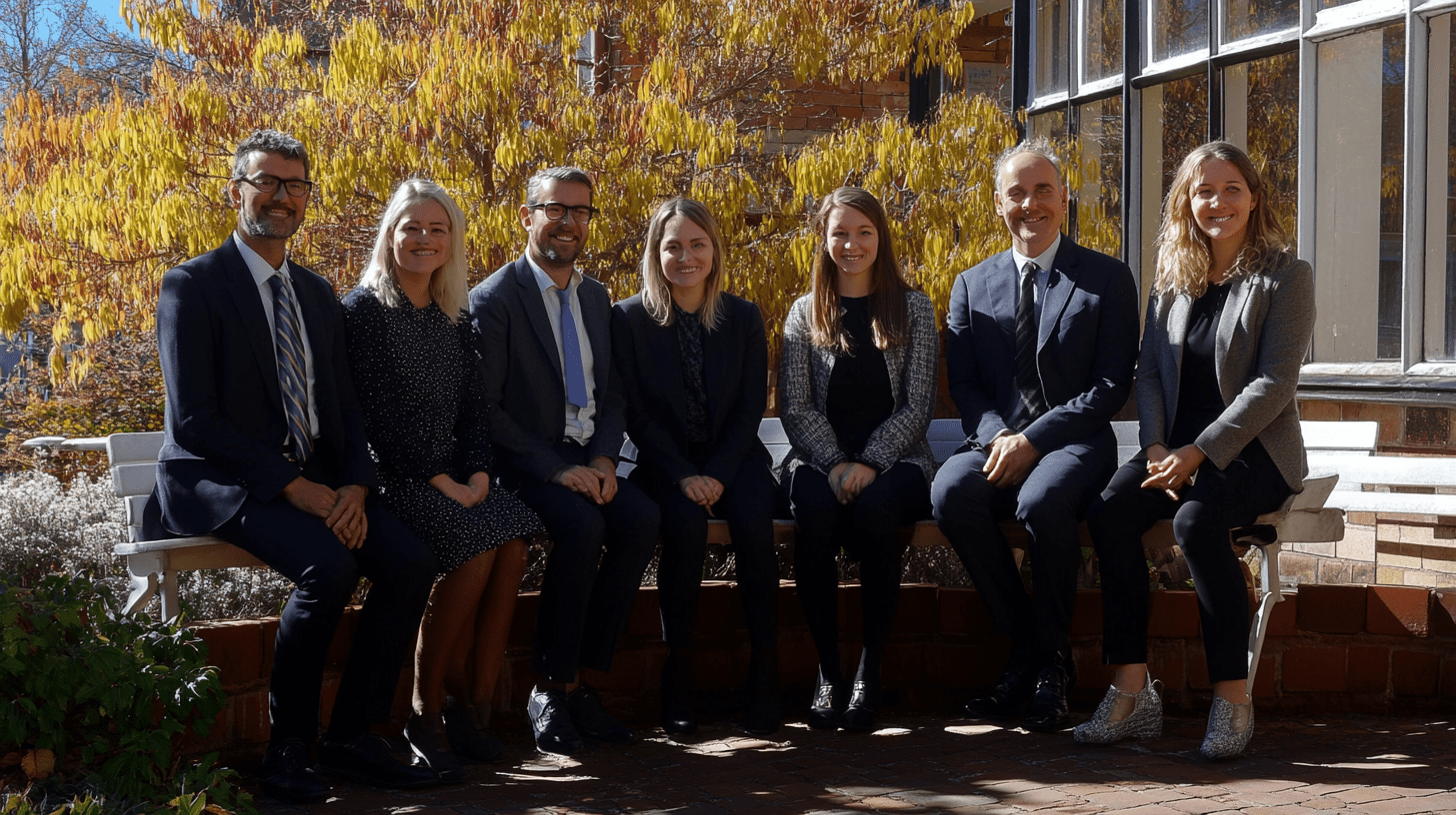 A team of lawyers posing for a photo outside in Launceston.