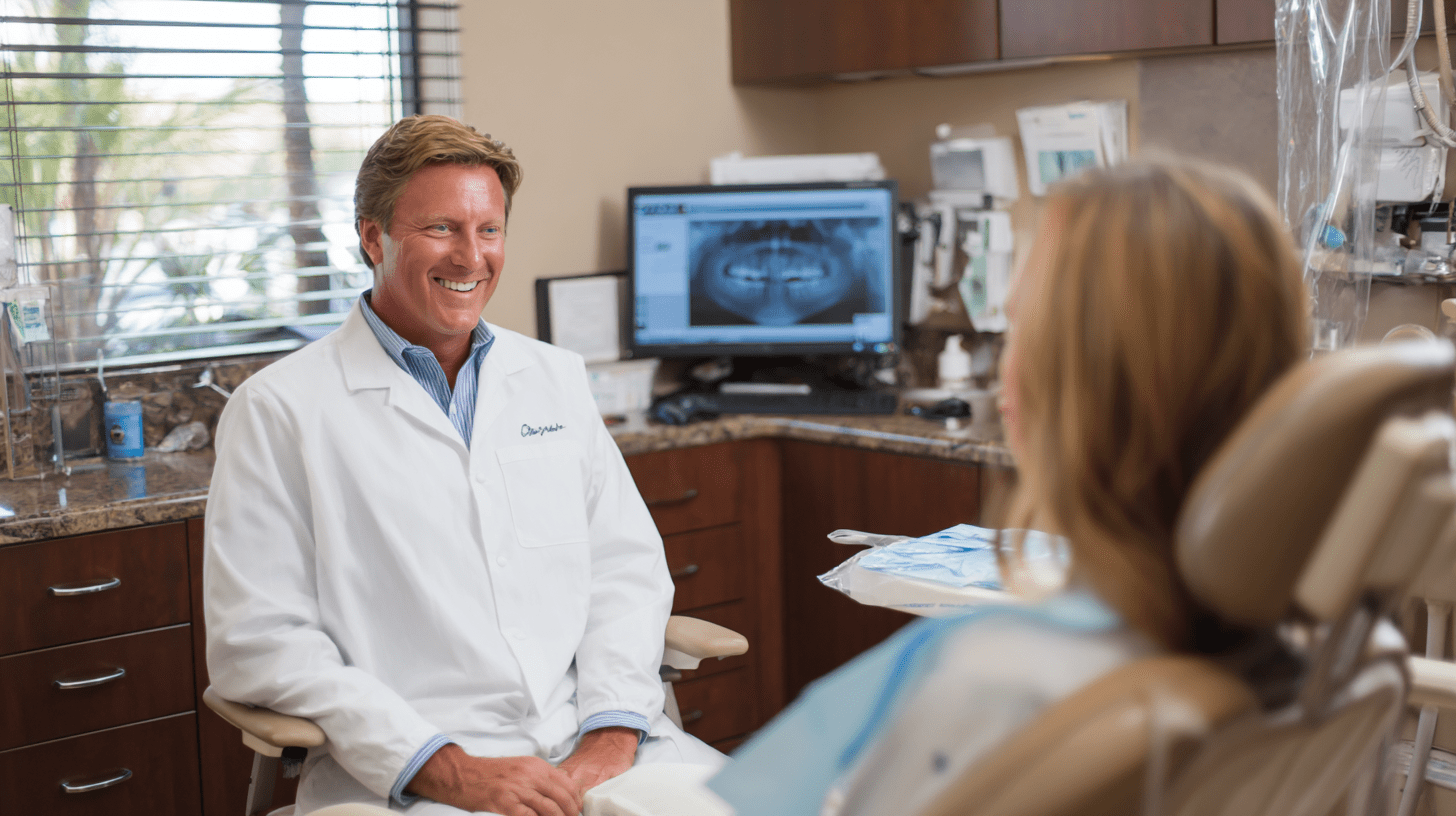 A dentist talking to one of his patients in his clinic in Vista, San Diego.
