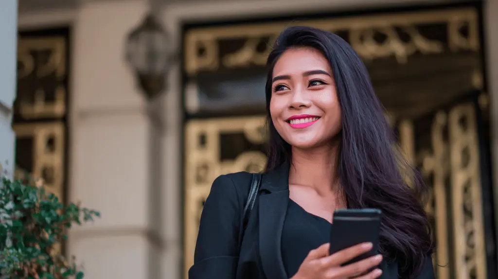 A Real Estate Agent looking at her local SEO results on her mobile phone.