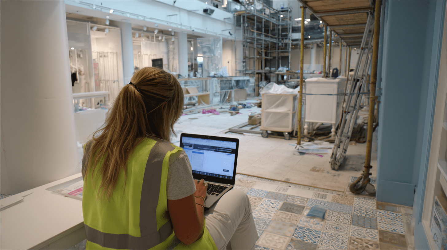 A retail store fitout contractor working on her laptop on technical SEO for her website.